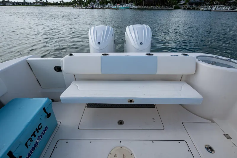 Mimi Too Yacht Photos Pics 2023 Robalo R302 Center Console boat with dual engines and seating area.