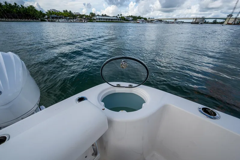 Mimi Too Yacht Photos Pics 2023 Robalo R302 Center Console boat with open livewell on calm water.