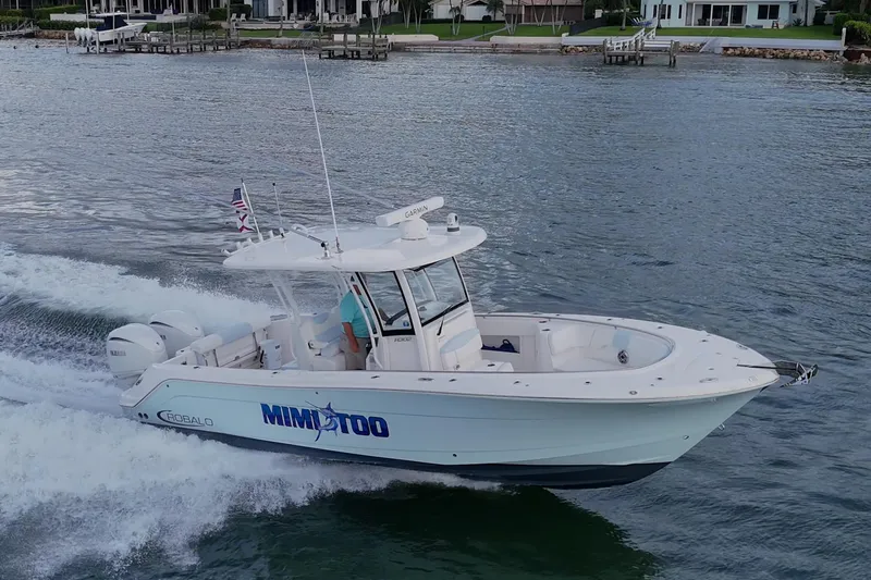 Mimi Too Yacht Photos Pics 2023 Robalo R302 Center Console boat cruising on a scenic waterway.