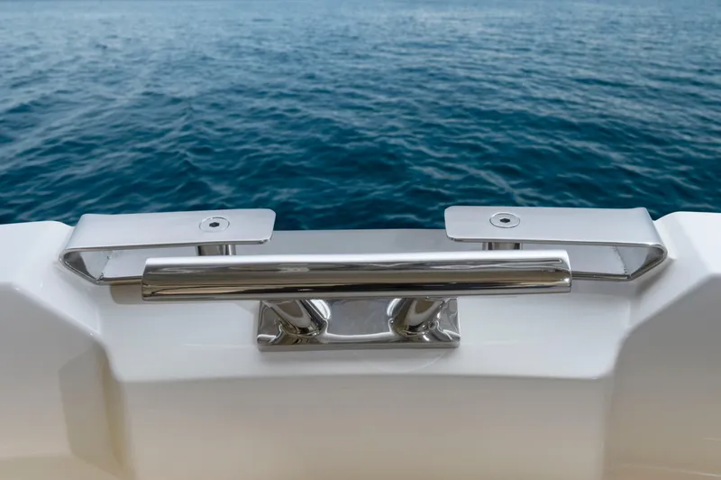 Pastiche Yacht Photos Pics Chrome cleat on 2019 Greenline Hybrid boat against ocean backdrop.