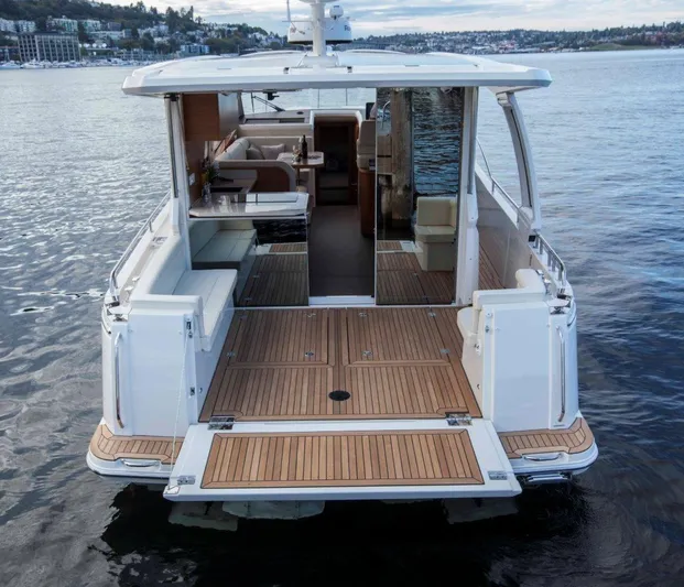 Pastiche Yacht Photos Pics 2019 Greenline Hybrid boat with open deck and modern interior on calm water.
