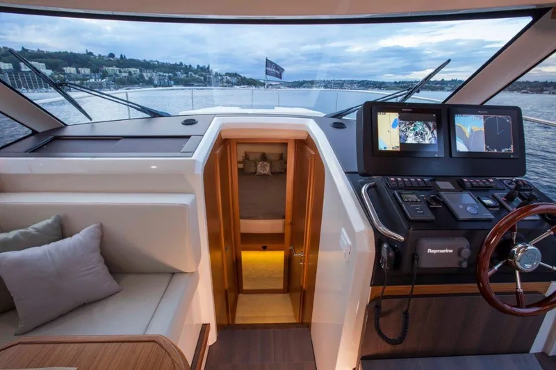 Pastiche Yacht Photos Pics 2019 Greenline Hybrid yacht interior with navigation system and seating area.