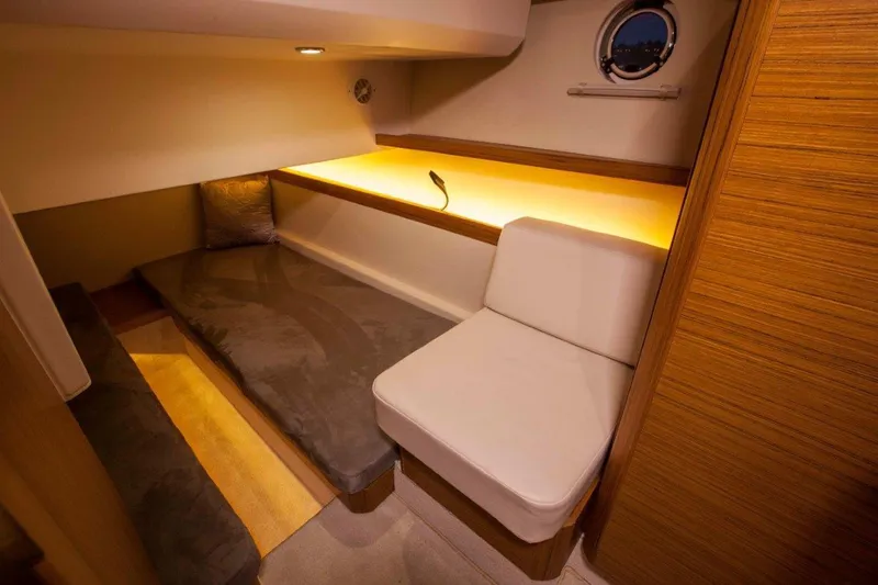 Pastiche Yacht Photos Pics Luxurious interior of 2019 Greenline Hybrid yacht with cozy seating and ambient lighting.