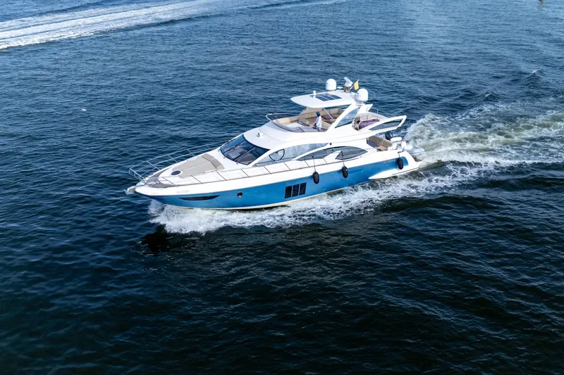 The Real D Yacht Photos Pics 2013 Azimut 60 Flybridge yacht cruising on open water.