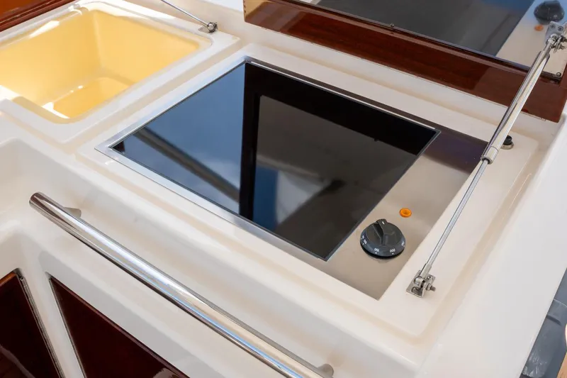 The Real D Yacht Photos Pics Azimut 60 Flybridge 2013 yacht kitchen with sleek stovetop and sink.