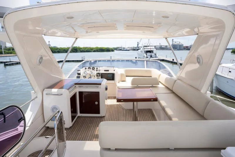 The Real D Yacht Photos Pics Luxurious 2013 Azimut 60 Flybridge yacht interior with spacious seating and elegant design.