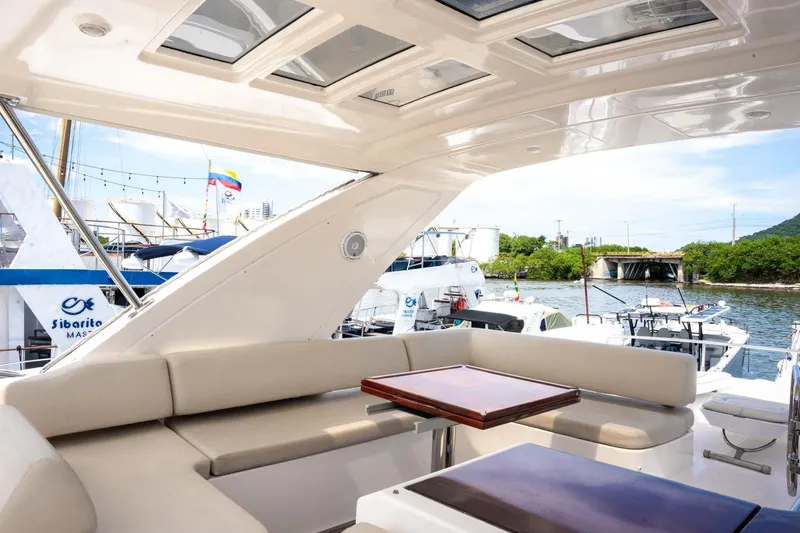 The Real D Yacht Photos Pics Luxurious 2013 Azimut 60 Flybridge yacht with elegant seating and scenic marina view.