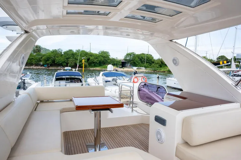 The Real D Yacht Photos Pics Luxurious 2013 Azimut 60 Flybridge yacht interior with elegant seating and scenic marina view.