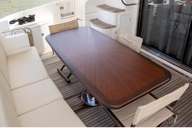 The Real D Yacht Photos Pics Luxurious Azimut 60 Flybridge 2013 yacht deck with elegant dining area.