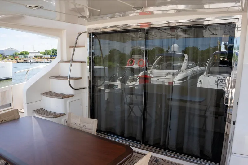 The Real D Yacht Photos Pics Azimut 60 Flybridge 2013 yacht with outdoor seating and glass doors.
