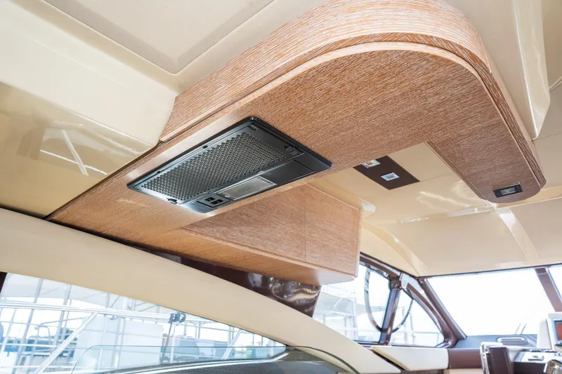 The Real D Yacht Photos Pics Interior view of 2013 Azimut 60 Flybridge yacht, featuring elegant wood paneling.