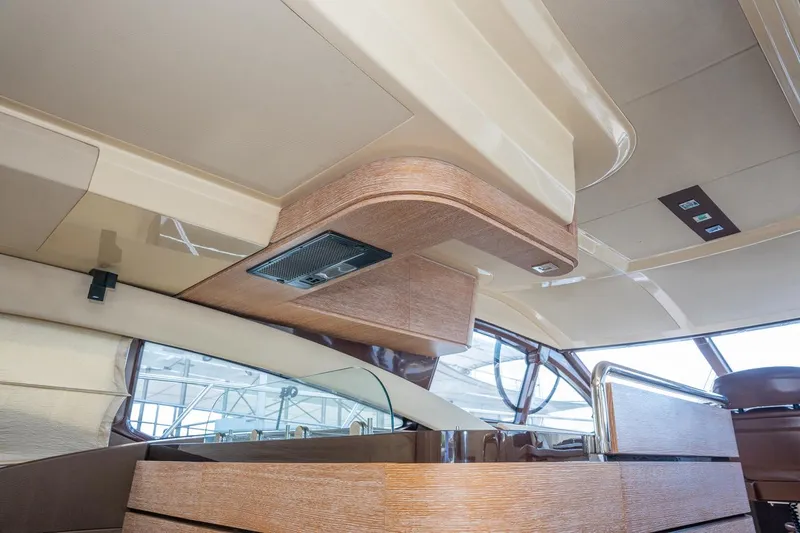 The Real D Yacht Photos Pics Interior view of 2013 Azimut 60 Flybridge yacht, featuring modern wood finishes and sleek design.