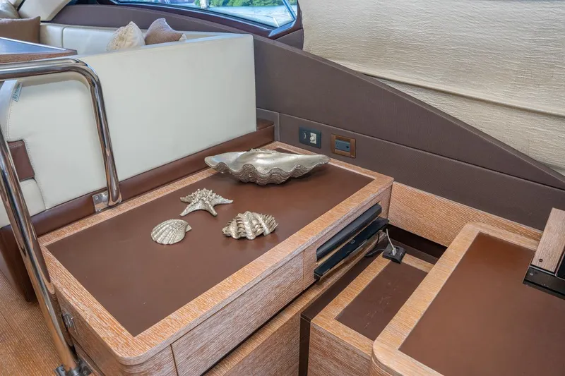 The Real D Yacht Photos Pics Azimut 60 Flybridge 2013 interior with decorative seashells on wooden table.