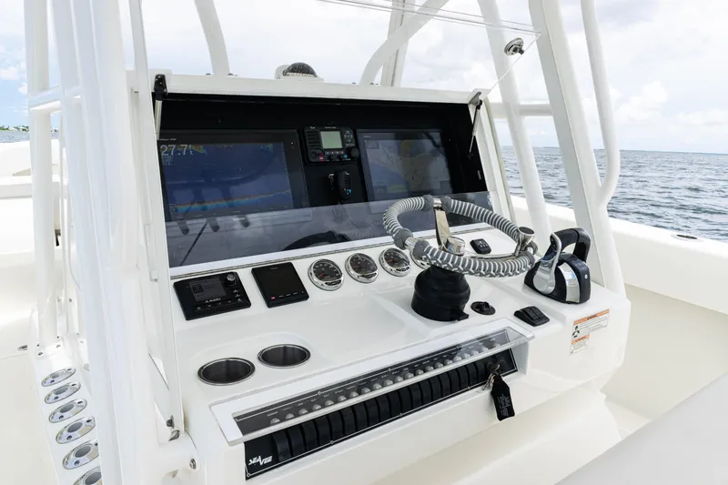  Yacht Photos Pics Control console of a 2017 SeaVee 370z boat with navigation equipment.