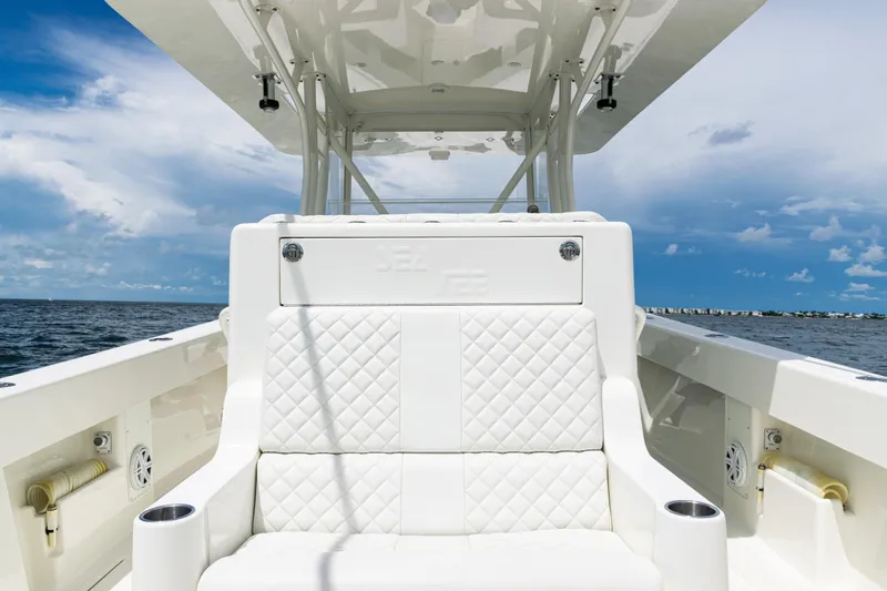  Yacht Photos Pics 2017 SeaVee 370z boat interior with white seating, ocean view, and blue sky.