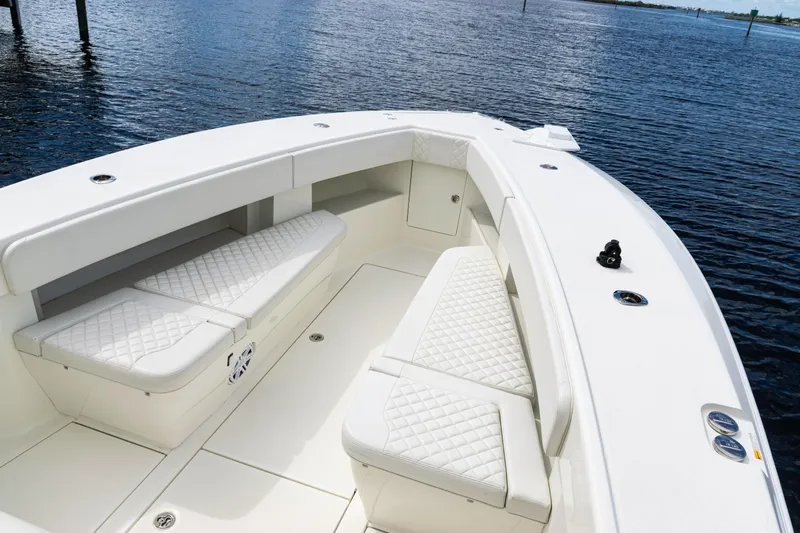  Yacht Photos Pics 2017 SeaVee 370z boat with white cushioned seating on calm water.