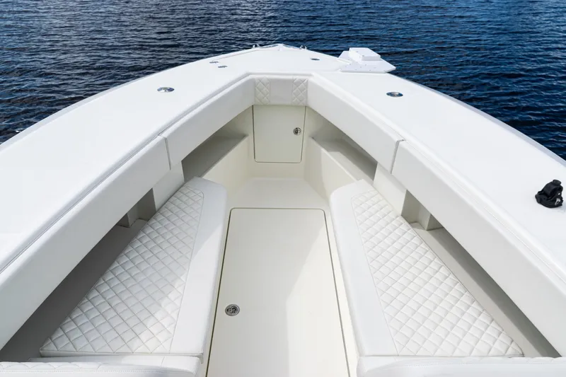  Yacht Photos Pics 2017 SeaVee 370z boat interior with white cushioned seating and ocean backdrop.