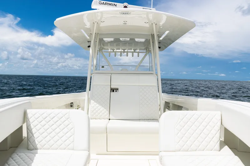 Yacht Photos Pics 2017 SeaVee 370z boat interior with white seating, ocean view, and blue sky.