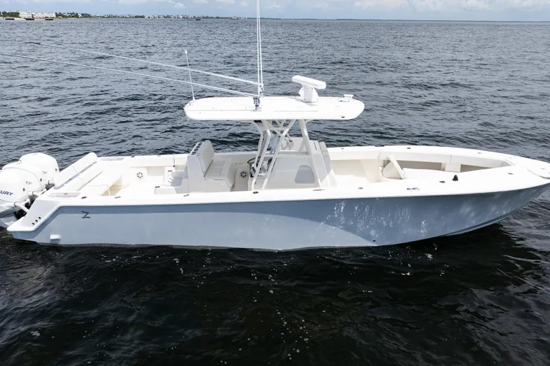  Yacht Photos Pics 2017 SeaVee 370z boat on open water, side view, with twin outboard engines.