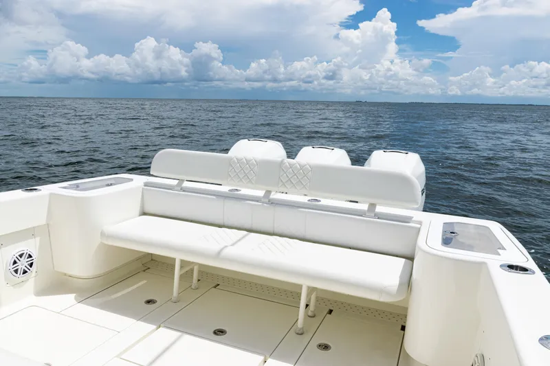  Yacht Photos Pics 2017 SeaVee 370z boat with white seating, ocean view, and cloudy sky.