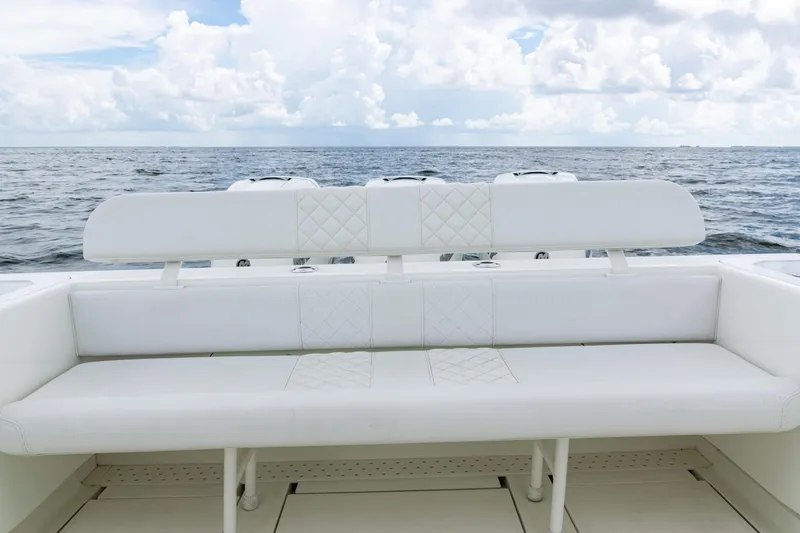  Yacht Photos Pics 2017 SeaVee 370z boat with white seating, ocean view, and cloudy sky.