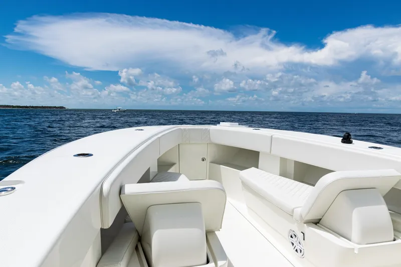  Yacht Photos Pics 2017 SeaVee 370z boat interior with white seating, ocean view, and blue sky.