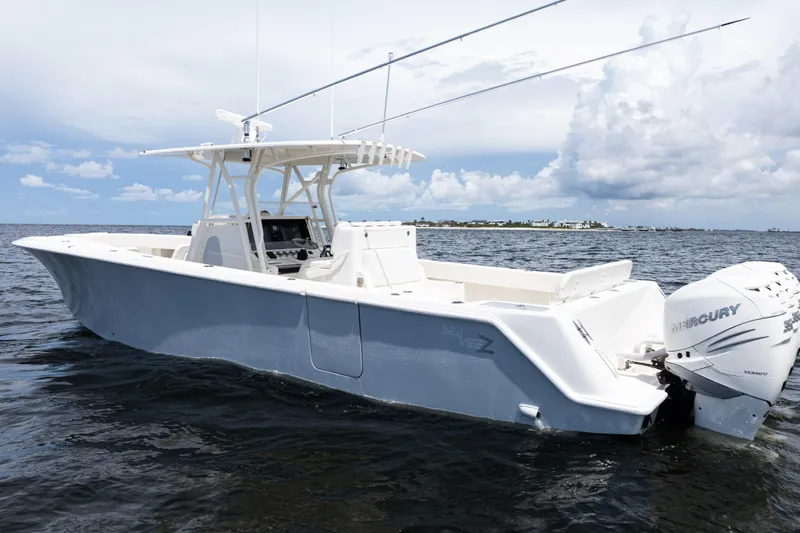  Yacht Photos Pics 2017 SeaVee 370z boat on water, featuring Mercury outboard engines, under a partly cloudy sky.