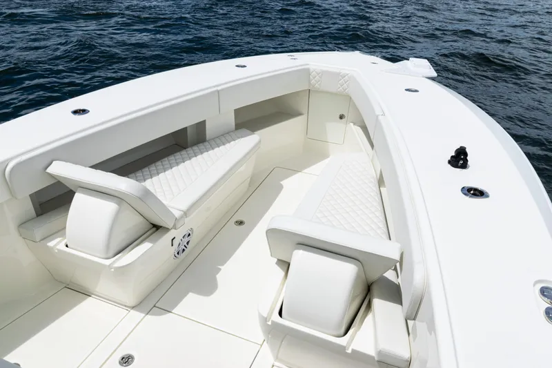  Yacht Photos Pics 2017 SeaVee 370z boat interior with white cushioned seating on open water.