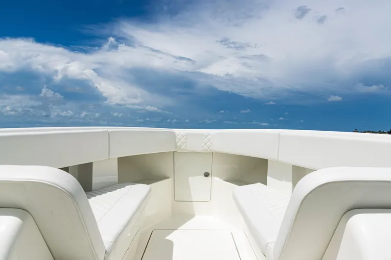  Yacht Photos Pics 2017 SeaVee 370z boat interior with white seating under a clear blue sky.