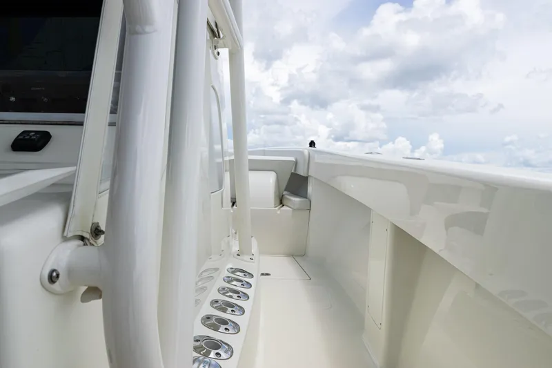  Yacht Photos Pics 2017 SeaVee 370z boat deck with rod holders, under a cloudy sky.