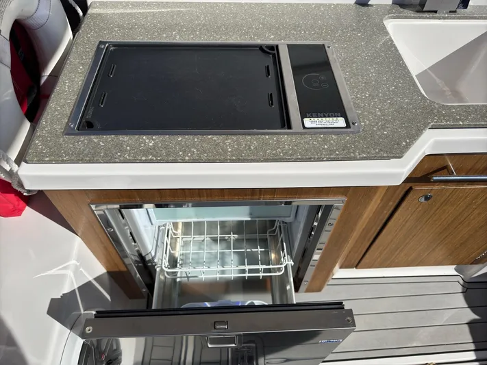 The Good Life Yacht Photos Pics 2019 Four Winns H350 boat kitchenette with grill and open fridge.