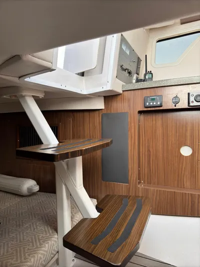 The Good Life Yacht Photos Pics Interior of 2019 Four Winns H350 boat with wooden steps and modern design.