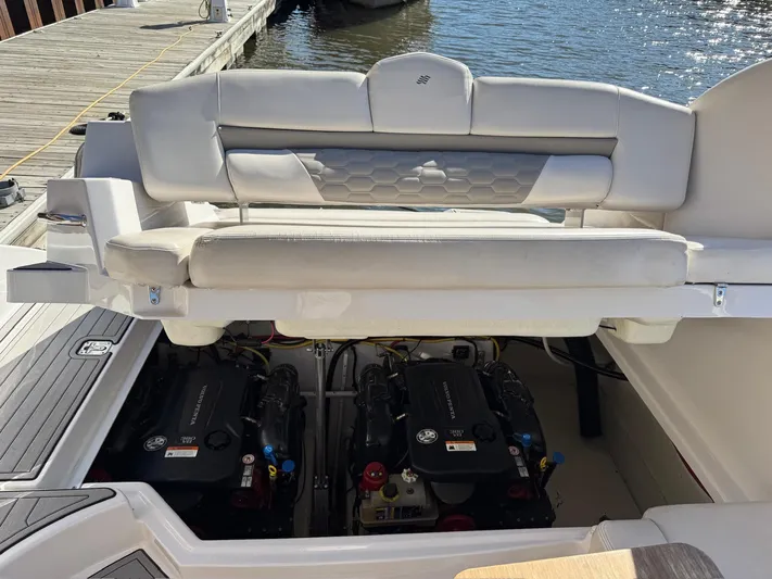 The Good Life Yacht Photos Pics 2019 Four Winns H350 boat engine compartment with dual engines, dockside view.
