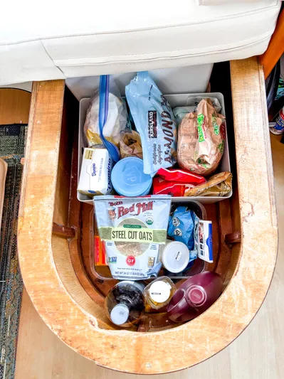  Yacht Photos Pics Storage compartment in a 2008 Leopard 46 yacht filled with various packaged food items.