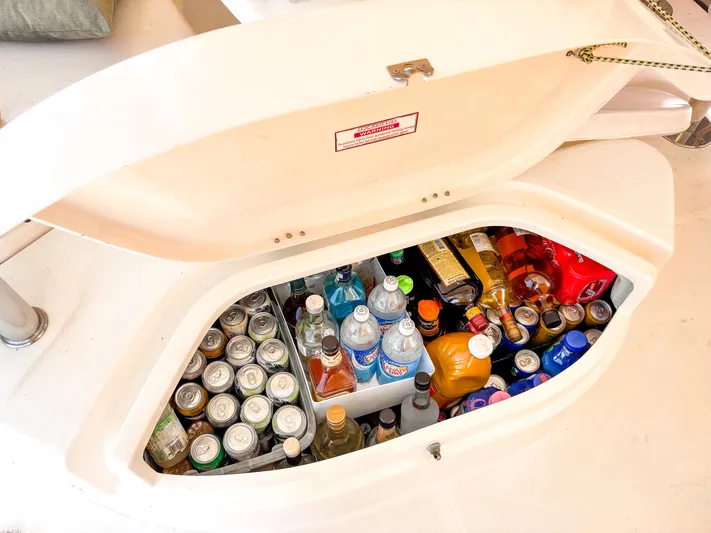  Yacht Photos Pics Beverage storage compartment on 2008 Leopard 46 yacht, filled with assorted drinks and bottles.
