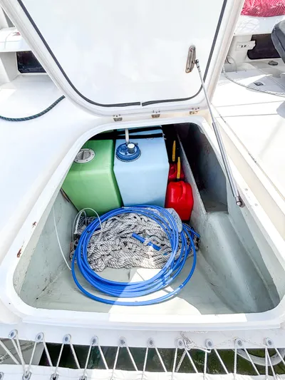  Yacht Photos Pics Storage compartment on a 2008 Leopard 46 boat with ropes and fuel containers.