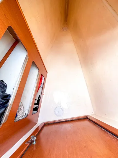  Yacht Photos Pics Interior view of a 2008 Leopard 46 sailboat cabin with wooden finishes.