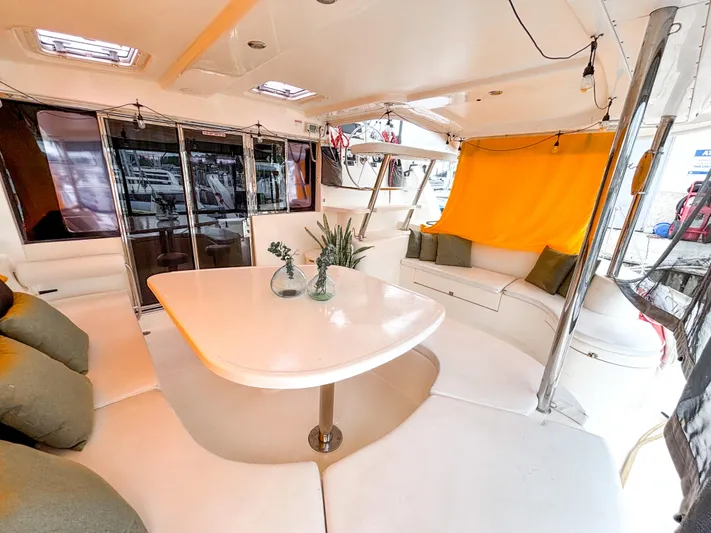  Yacht Photos Pics Luxurious interior of 2008 Leopard 46 catamaran with modern seating and table.