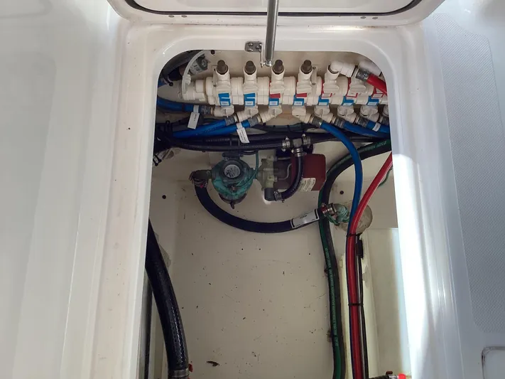  Yacht Photos Pics 2017 Pursuit DC 325 Dual Console boat plumbing system with valves and hoses.