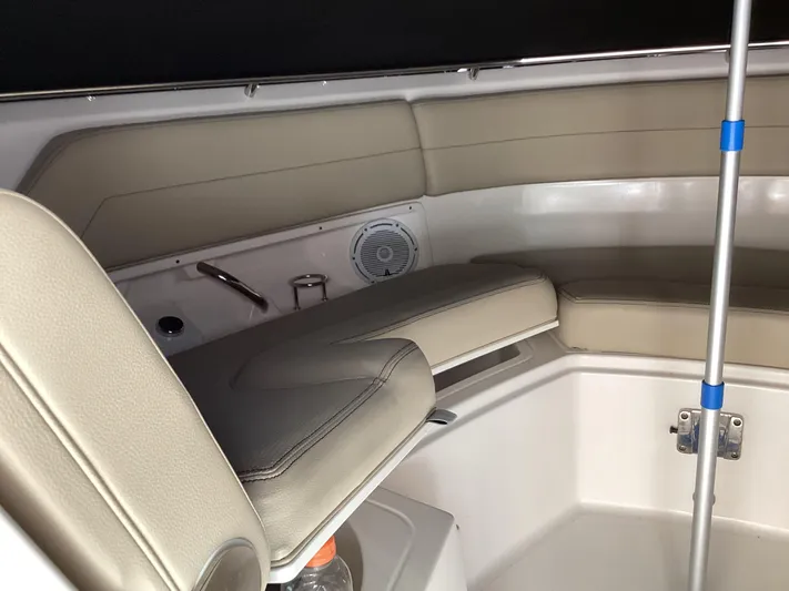  Yacht Photos Pics 2017 Pursuit DC 325 Dual Console interior with beige seating and speaker.