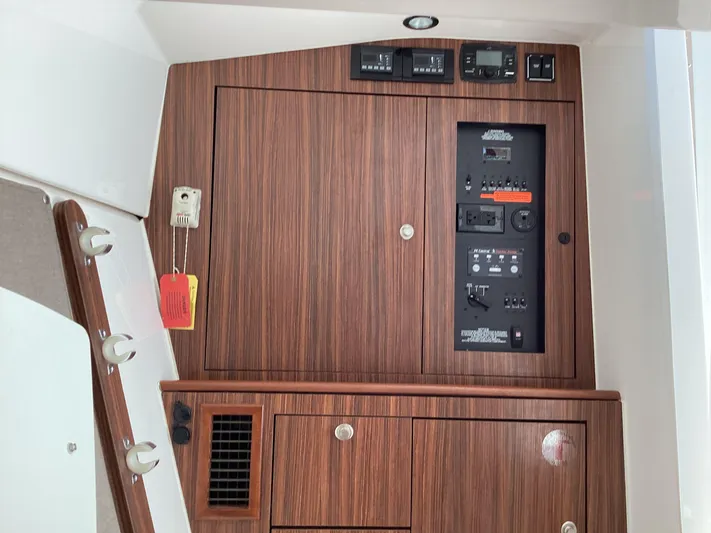  Yacht Photos Pics 2017 Pursuit DC 325 Dual Console interior control panel with wood finish.