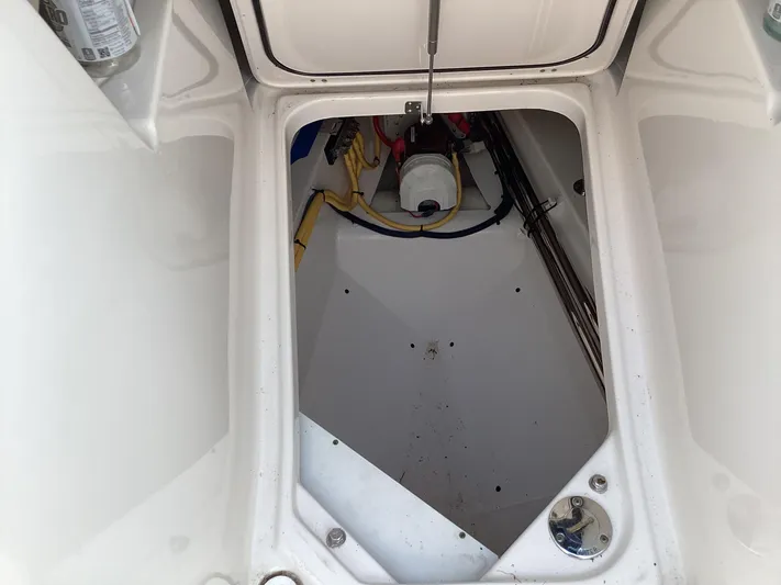  Yacht Photos Pics 2017 Pursuit DC 325 Dual Console storage compartment with visible wiring and equipment.