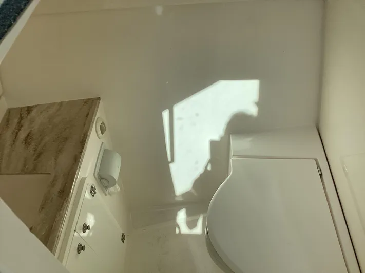  Yacht Photos Pics 2017 Pursuit DC 325 Dual Console interior with countertop and storage cabinets.