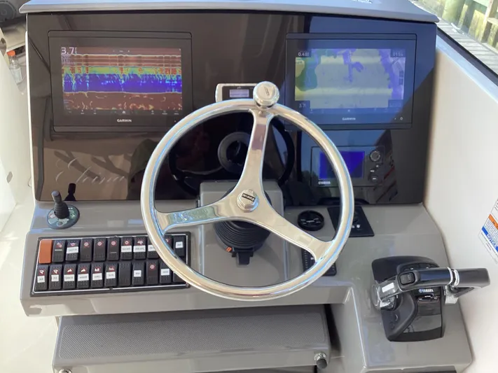  Yacht Photos Pics 2017 Pursuit DC 325 Dual Console helm with Garmin displays and Yamaha controls.