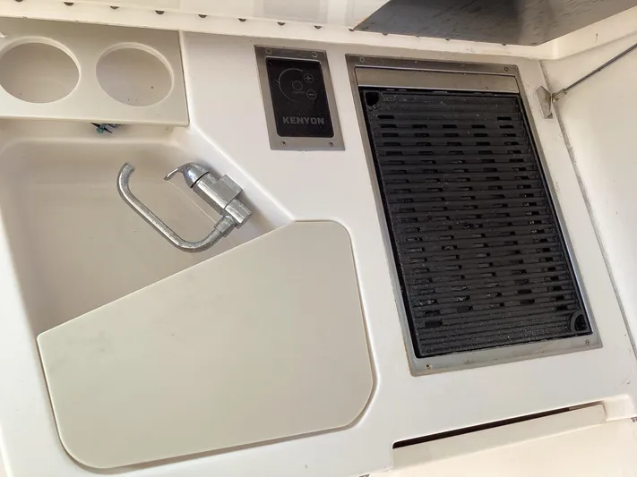  Yacht Photos Pics 2017 Pursuit DC 325 Dual Console boat kitchen area with sink and grill.