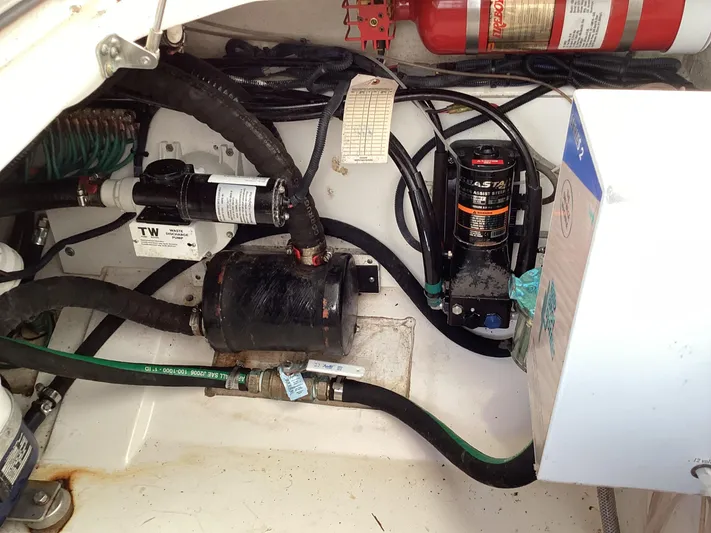  Yacht Photos Pics 2017 Pursuit DC 325 Dual Console engine compartment with hoses, wiring, and fire extinguisher.