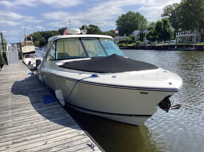  Yacht Photos Pics 2017 Pursuit DC 325 Dual Console boat docked on a sunny day.