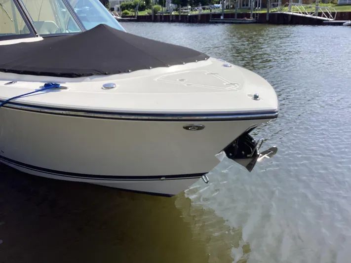  Yacht Photos Pics 2017 Pursuit DC 325 Dual Console boat docked on calm water.