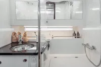 Luxurious bathroom in 2022 Nimbus T11 yacht with modern fixtures and elegant design.