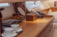 Luxurious interior of 2022 Nimbus T11 yacht with elegant wooden finish and cozy decor.